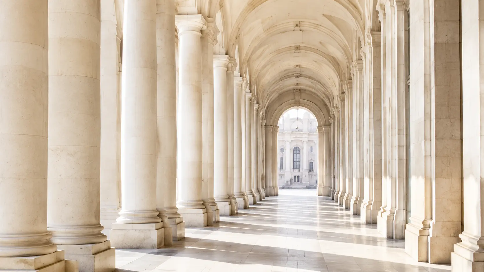 A bright classical colonnade representing a clear and structured route forward