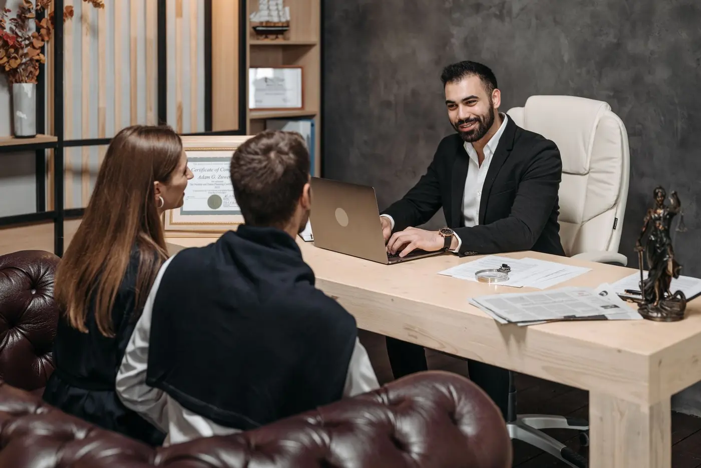 Business professionals working through a disagreement with a neutral facilitator